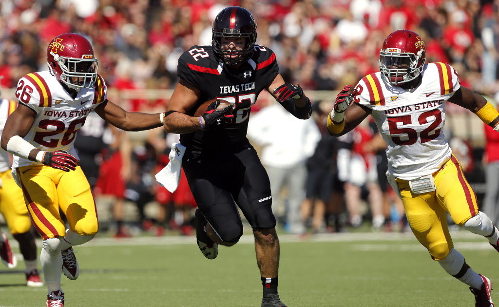 Texas Tech's Jace Amaro (22) gets by Iowa State's Deon Broomfield (26) and Jeremiah George (52) during their NCAA college football game in Lubbock, Texas, Saturday, Oct. 12, 2013. (AP Photo/Lubbock Avalanche-Journal, Stephen Spillman)