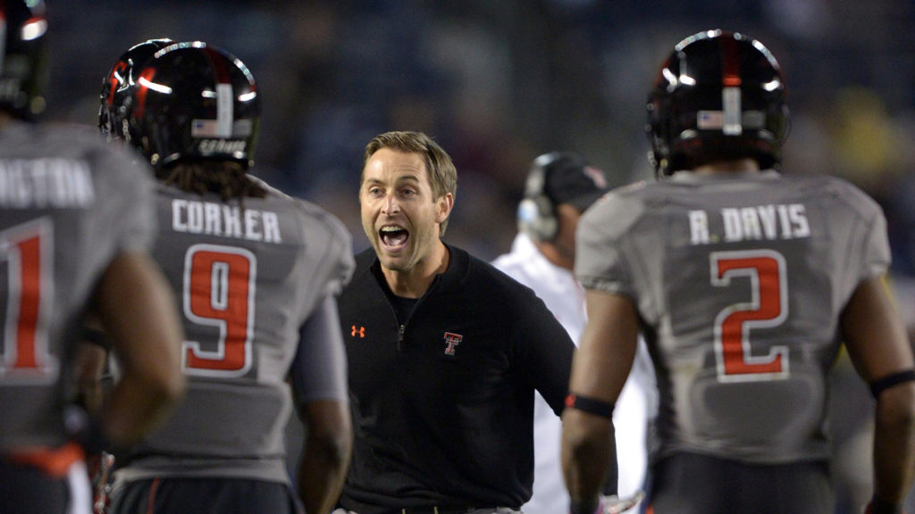 Dec 30, 2013; San Diego, CA, USA; Texas Tech Red Raiders coach Kliff Kingsbury celebrates after a touchdown against the Arizona State Sun Devils during the 2013 Holiday Bowl at Qualcomm Stadium. Mandatory Credit: Kirby Lee-USA TODAY Sports