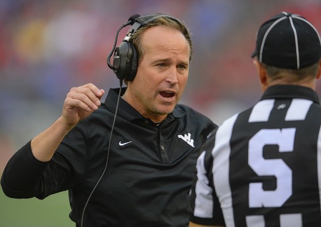 West Virginia head coach Dana Holgorsen questions a referee during the first half of their game with Maryland at M&T Bank Stadium in Baltimore, Maryland, Saturday, September 21, 2013. (Doug Kapustin/MCT via Getty Images)