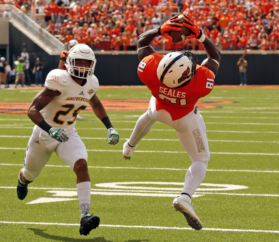 Oklahoma State's Jhajuan Seales scores on a pass during the college football game between the Oklahoma State Cowboys (OSU) and the Southeastern Louisiana Lions at Boone Pickens Stadium in Stillwater, Okla., Saturday, Sept. 12, 2015. Photo by Steve Sisney, The Oklahoman