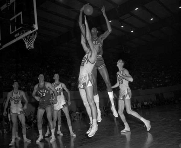 Hub Reed and Wilt Chamberlain battle in the NCAA tournament in Dallas, Tx.